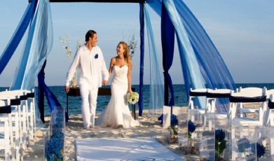 blue wedding theme with bride and groom recessional