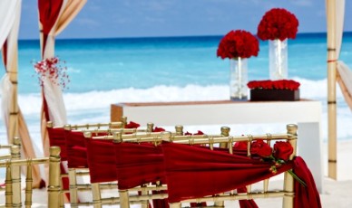 red chair covers with beach and red bouquets